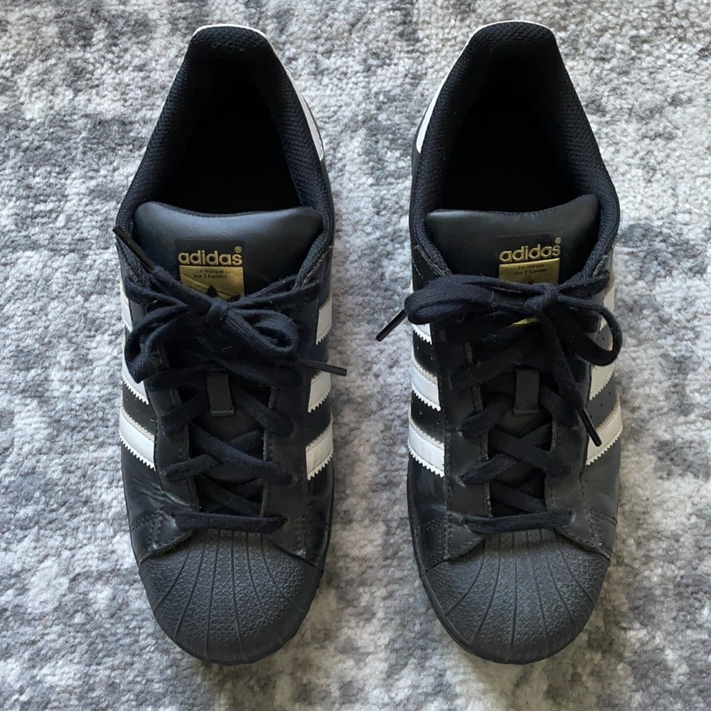 Adidas black and white Superstar sneakers